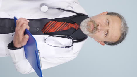 Vertical-video-of-Angry-old-doctor.